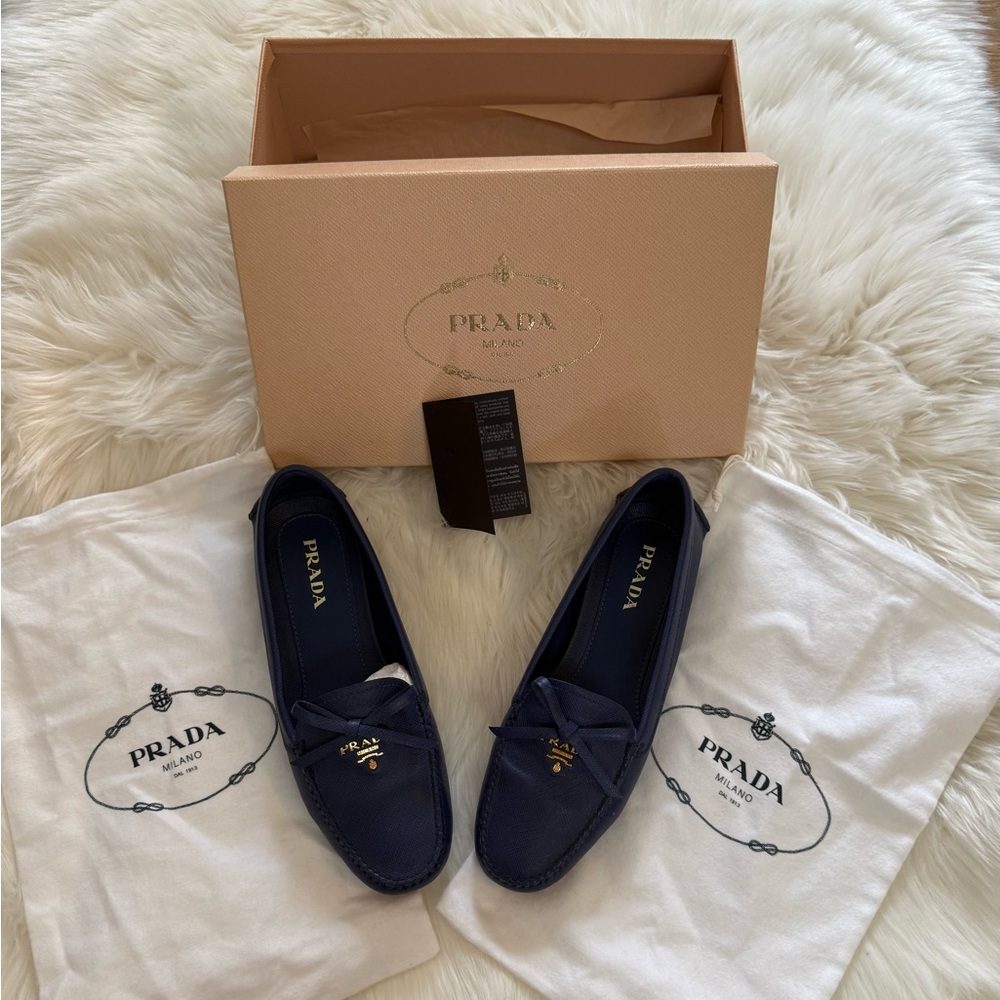 Gently used Prada loafers. Comes with two dust bags and original box.